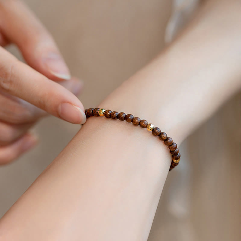 Pulsera protectora con cuentas de cobre bañadas en oro de 14 quilates y sándalo ultrafinas de 4 mm y Buddha Stones