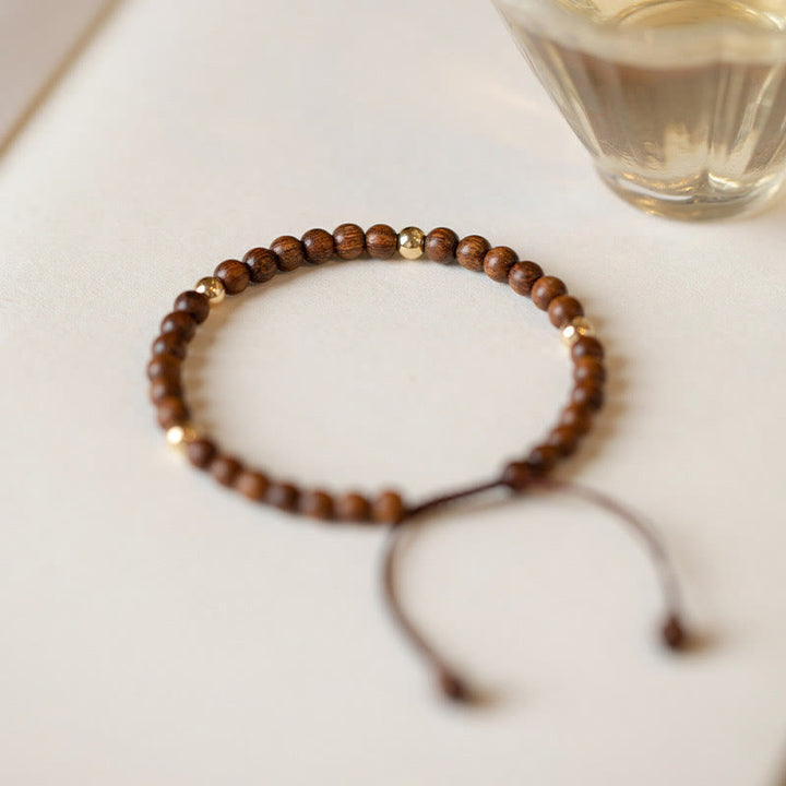 Pulsera protectora con cuentas de cobre bañadas en oro de 14 quilates y sándalo ultrafinas de 4 mm y Buddha Stones