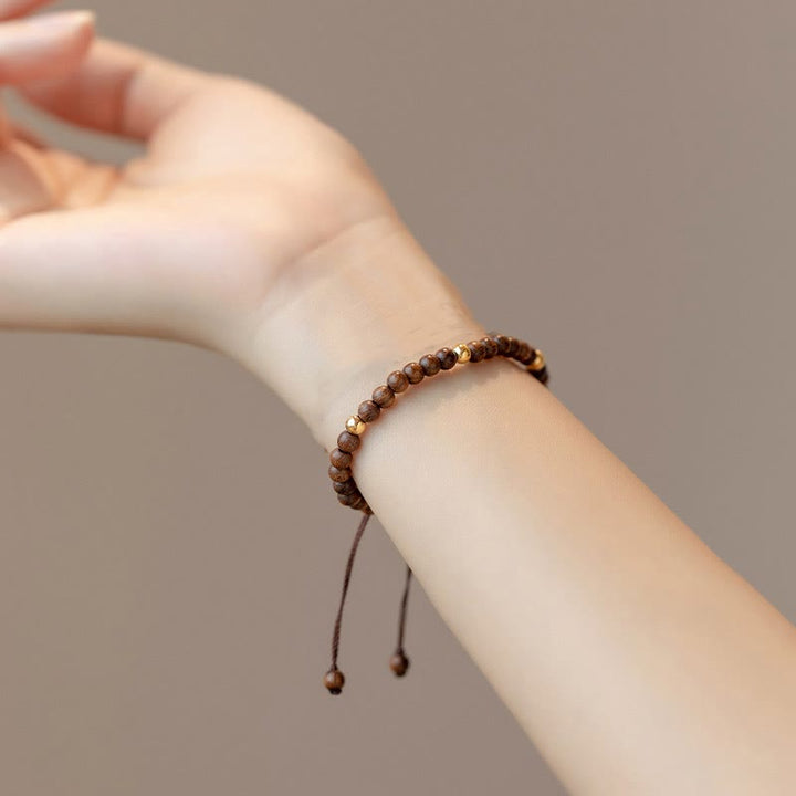 Pulsera protectora con cuentas de cobre bañadas en oro de 14 quilates y sándalo ultrafinas de 4 mm y Buddha Stones