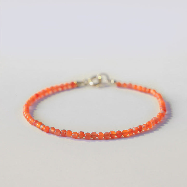 Pulsera de confianza con cuentas ultrafinas de ágata roja, cereza y caqui naturales de Buddha Stones