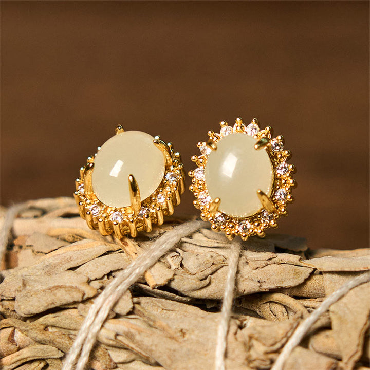 Pendientes de prosperidad de cobre con forma de huevo de jade hetiano natural y Buddha Stones