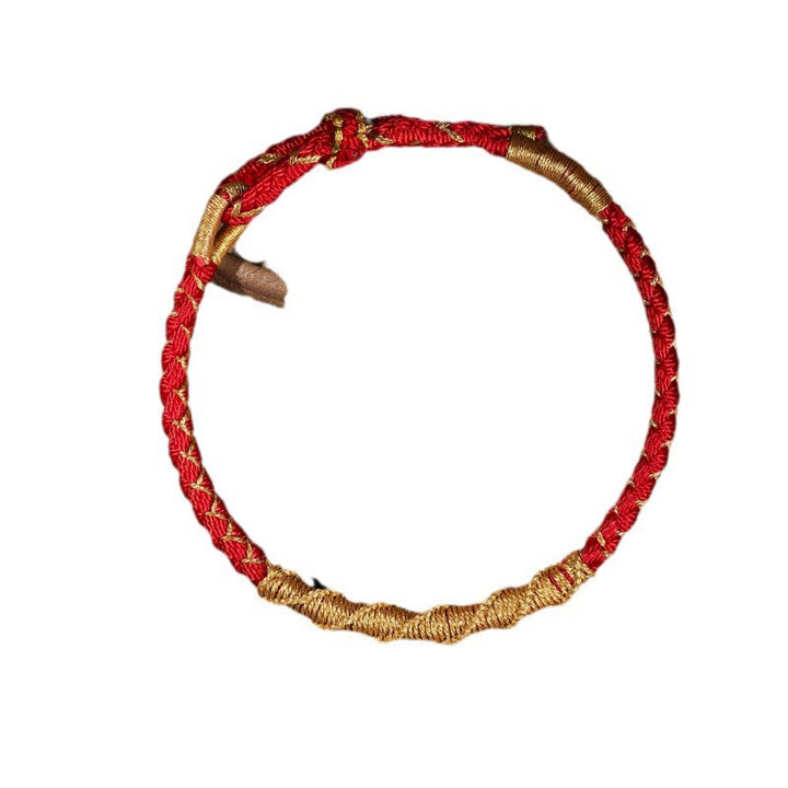 Pulsera trenzada de protección con nudo de escamas de dragón y hilo dorado tibetano de Buddha Stones