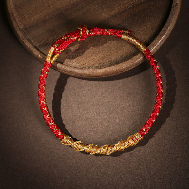 Pulsera trenzada de protección con nudo de escamas de dragón y hilo dorado tibetano de Buddha Stones