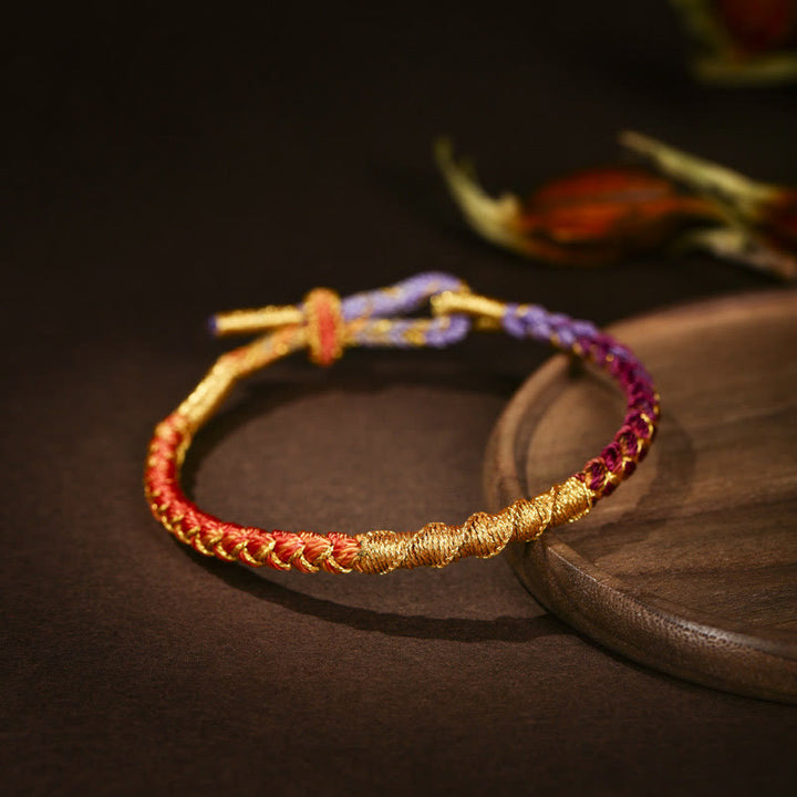 Pulsera trenzada de protección con nudo de escamas de dragón y hilo dorado tibetano de Buddha Stones