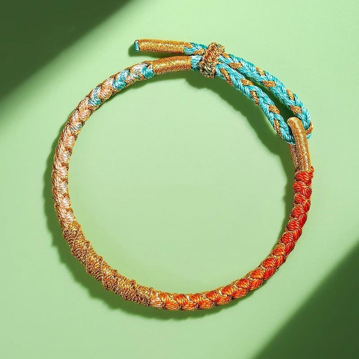 Pulsera trenzada de protección con nudo de escamas de dragón y hilo dorado tibetano de Buddha Stones