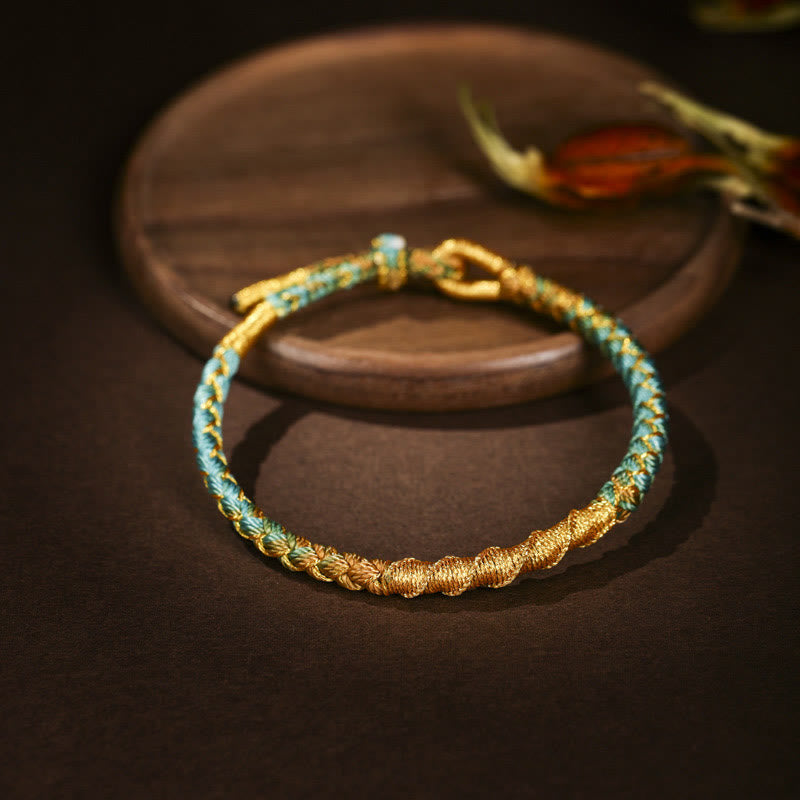 Pulsera trenzada de protección con nudo de escamas de dragón y hilo dorado tibetano de Buddha Stones