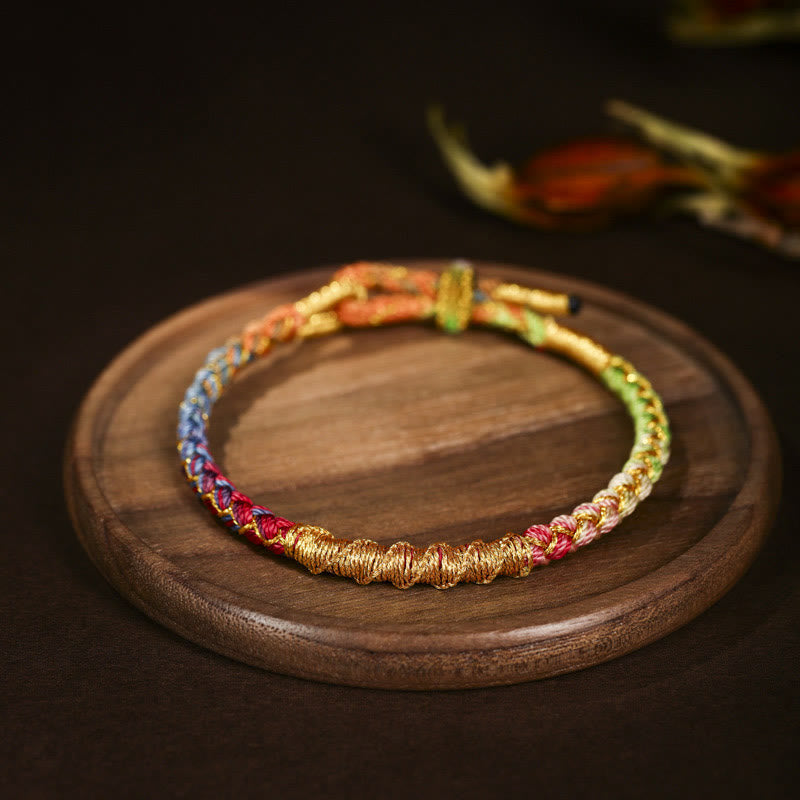 Pulsera trenzada de protección con nudo de escamas de dragón y hilo dorado tibetano de Buddha Stones