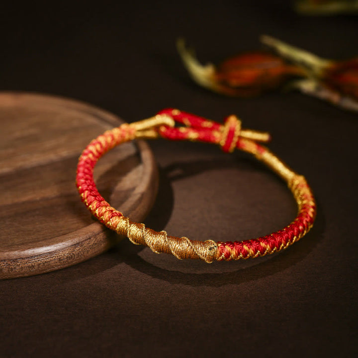 Pulsera trenzada de protección con nudo de escamas de dragón y hilo dorado tibetano de Buddha Stones