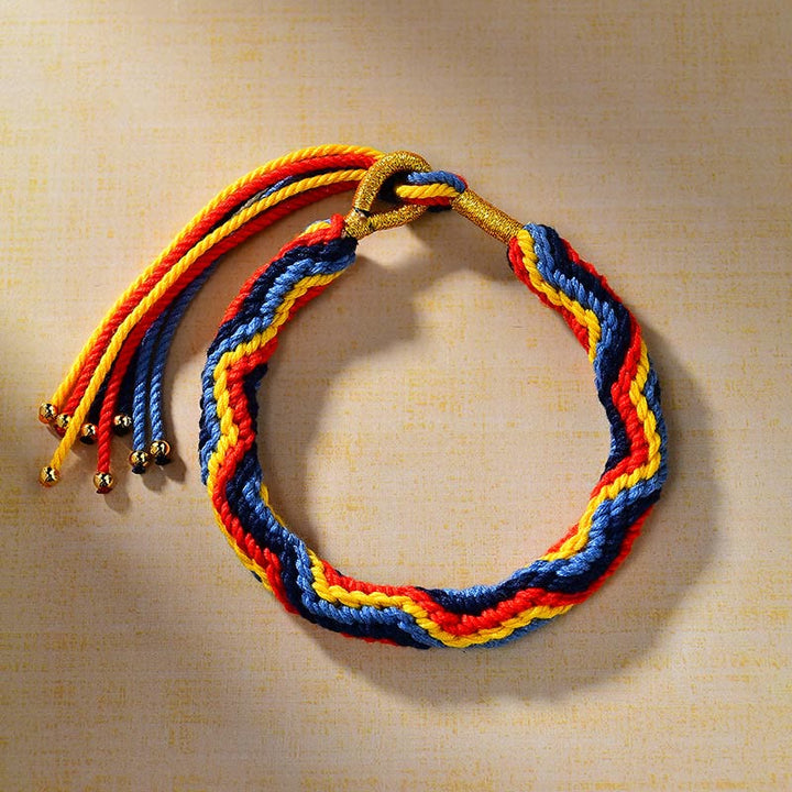 Pulsera de la suerte de cuerda de colores tejida a mano con Buddha Stones tibetanas