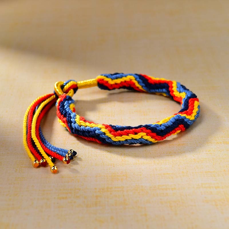 Pulsera de la suerte de cuerda de colores tejida a mano con Buddha Stones tibetanas