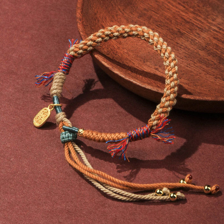 Pulsera de la suerte Nafu con borlas ajustables de cuerda de colores tejida a mano tibetana con Buddha Stones