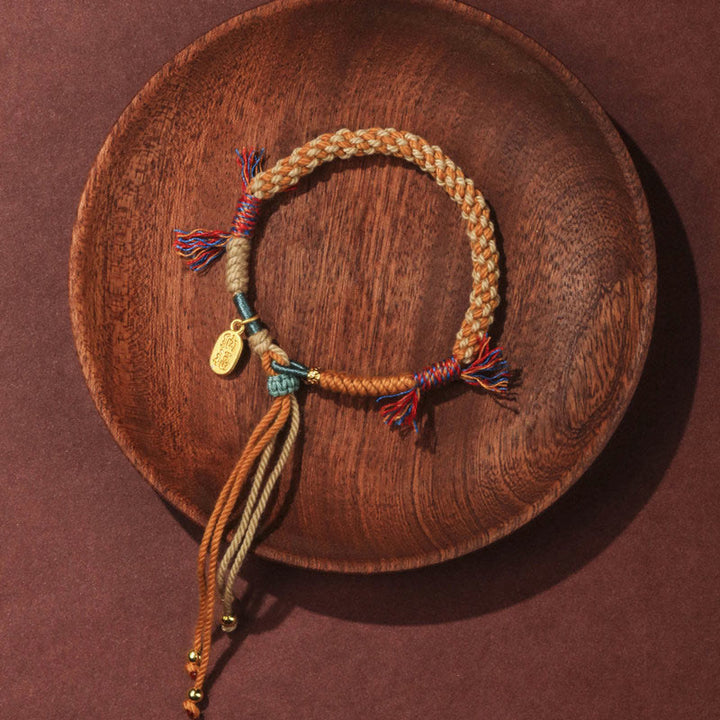 Pulsera de la suerte Nafu con borlas ajustables de cuerda de colores tejida a mano tibetana con Buddha Stones