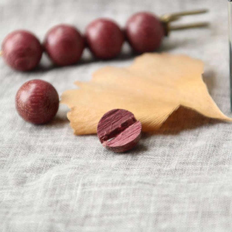 Broche curativo con cuentas de peltogyne, agathis alba, sándalo y madera de ébano de Buddha Stones