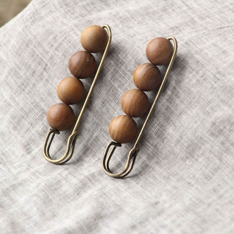 Broche curativo con cuentas de peltogyne, agathis alba, sándalo y madera de ébano de Buddha Stones