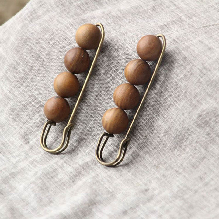 Broche curativo con cuentas de peltogyne, agathis alba, sándalo y madera de ébano de Buddha Stones