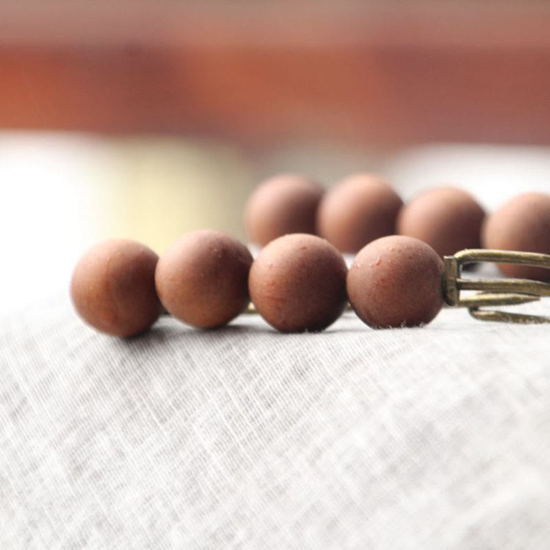Broche curativo con cuentas de peltogyne, agathis alba, sándalo y madera de ébano de Buddha Stones