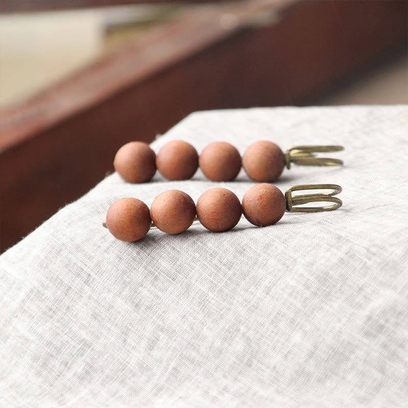 Broche curativo con cuentas de peltogyne, agathis alba, sándalo y madera de ébano de Buddha Stones