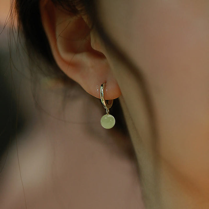 Pendientes de prosperidad con cuentas redondas de jade y Buddha Stones
