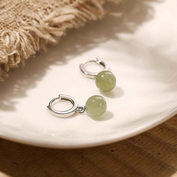 Pendientes de prosperidad con cuentas redondas de jade y Buddha Stones