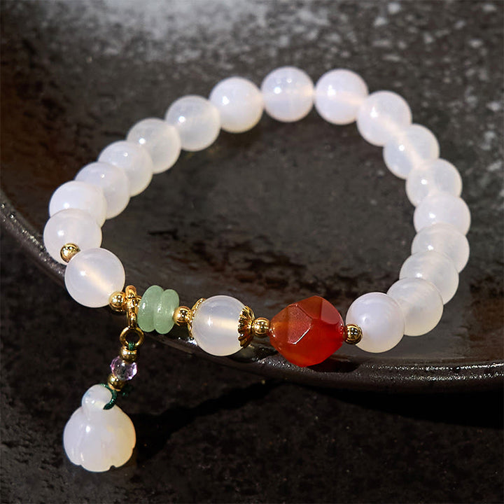 Pulsera con amuleto de la suerte con forma de vaina de loto y ágata blanca y ágata roja de Buddha Stones