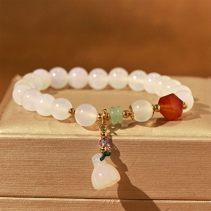 Pulsera con amuleto de la suerte con forma de vaina de loto y ágata blanca y ágata roja de Buddha Stones