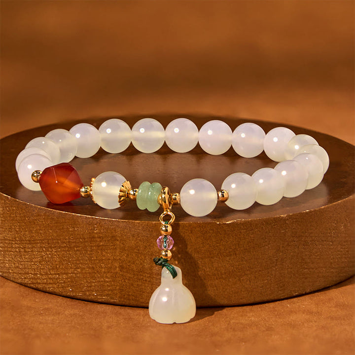 Pulsera con amuleto de la suerte con forma de vaina de loto y ágata blanca y ágata roja de Buddha Stones