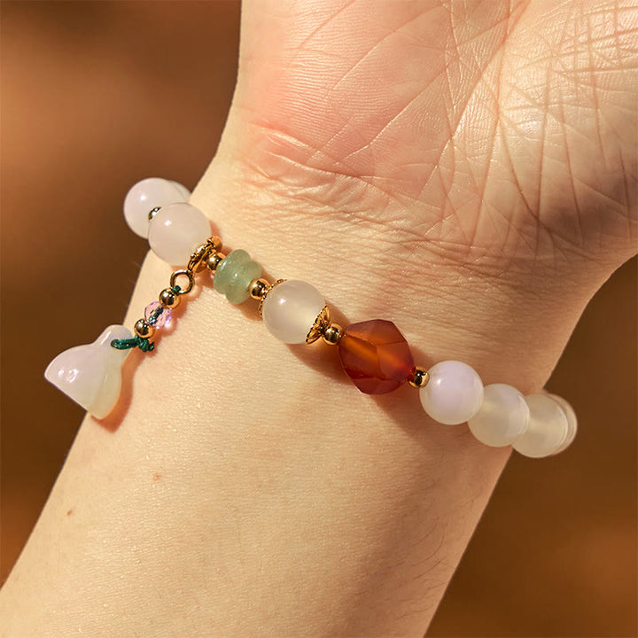 Pulsera con amuleto de la suerte con forma de vaina de loto y ágata blanca y ágata roja de Buddha Stones