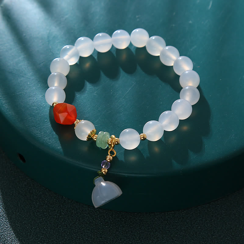 Pulsera con amuleto de la suerte con forma de vaina de loto y ágata blanca y ágata roja de Buddha Stones
