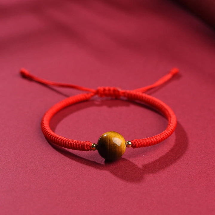 Pulsera de cuerda con cuentas de ojo de tigre y protección de la suerte hecha a mano con Buddha Stones