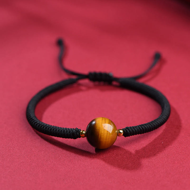 Pulsera de cuerda con cuentas de ojo de tigre y protección de la suerte hecha a mano con Buddha Stones