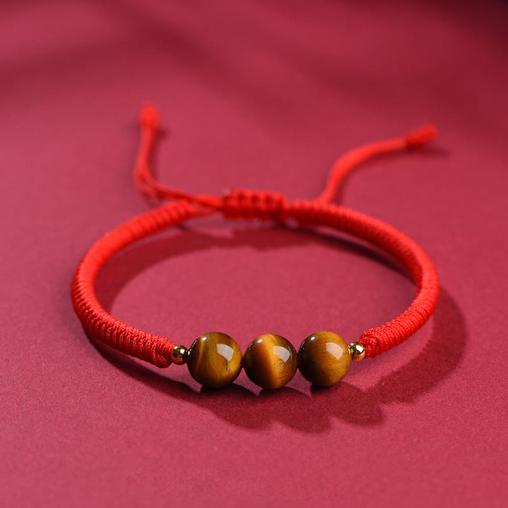 Pulsera de cuerda con cuentas de ojo de tigre y protección de la suerte hecha a mano con Buddha Stones