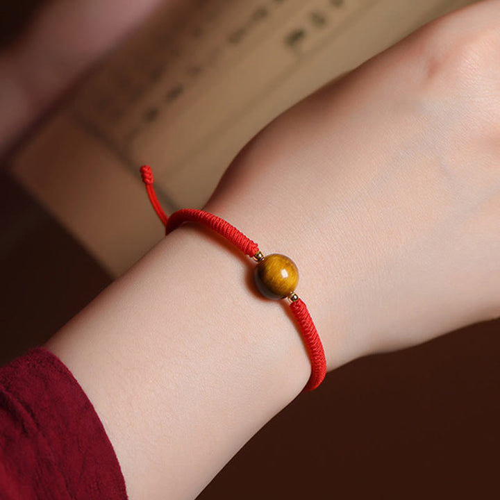 Pulsera de cuerda con cuentas de ojo de tigre y protección de la suerte hecha a mano con Buddha Stones