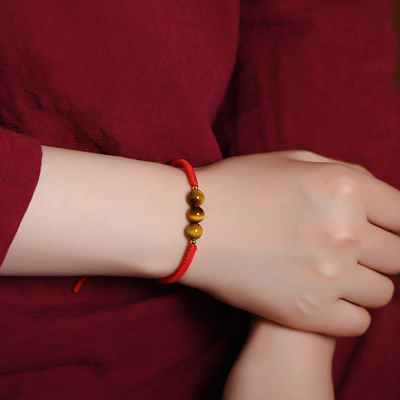 Pulsera de cuerda con cuentas de ojo de tigre y protección de la suerte hecha a mano con Buddha Stones
