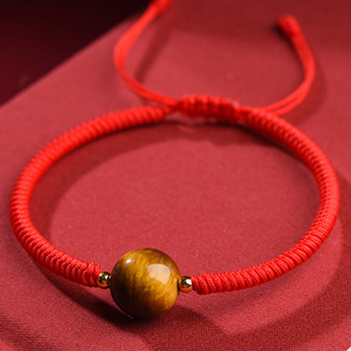 Pulsera de cuerda con cuentas de ojo de tigre y protección de la suerte hecha a mano con Buddha Stones