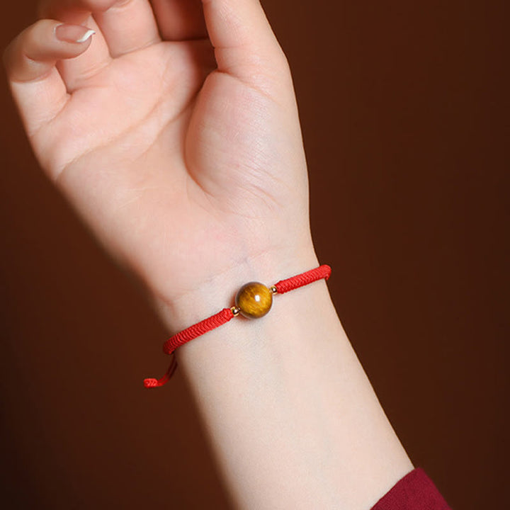 Pulsera de cuerda con cuentas de ojo de tigre y protección de la suerte hecha a mano con Buddha Stones