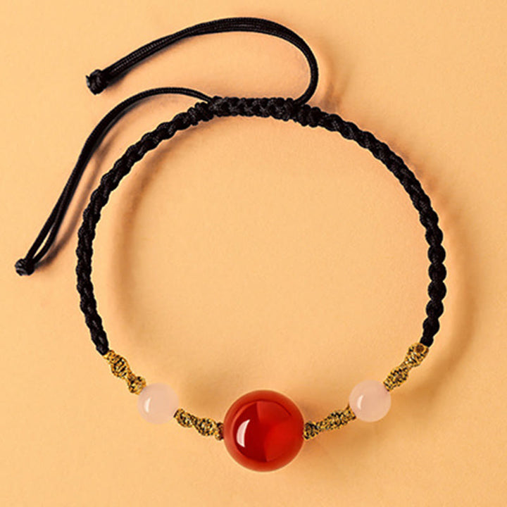 Pulsera trenzada de la suerte con cuentas de ágata roja, ónix negro y jade hetiano de Buddha Stones