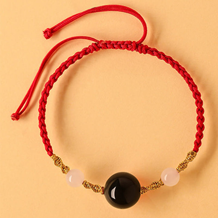 Pulsera trenzada de la suerte con cuentas de ágata roja, ónix negro y jade hetiano de Buddha Stones