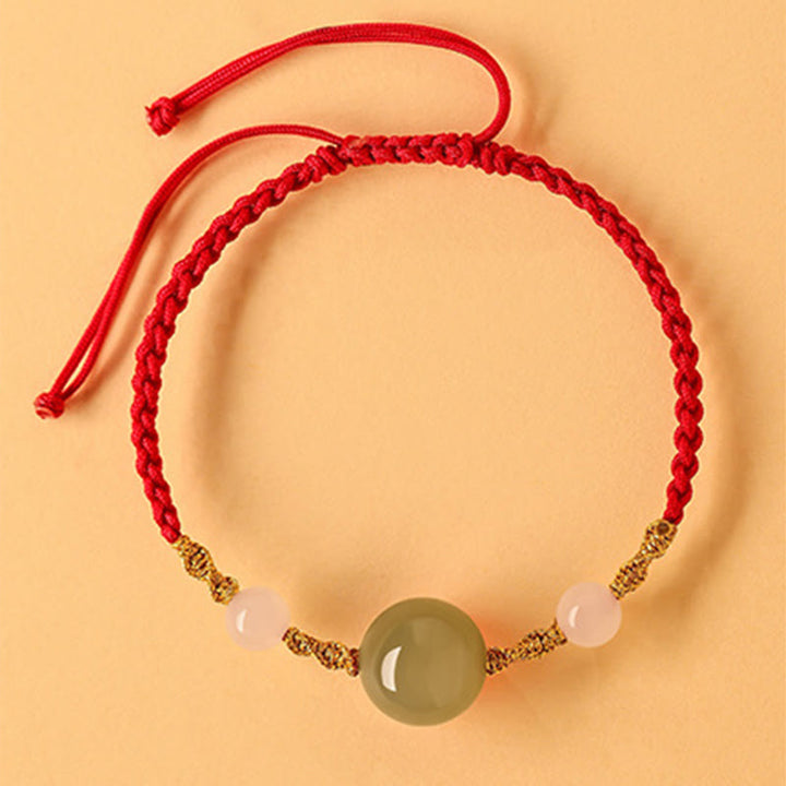 Pulsera trenzada de la suerte con cuentas de ágata roja, ónix negro y jade hetiano de Buddha Stones