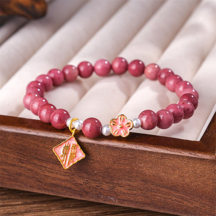Pulsera de energía amorosa con rodonita y flor de durazno de Buddha Stones
