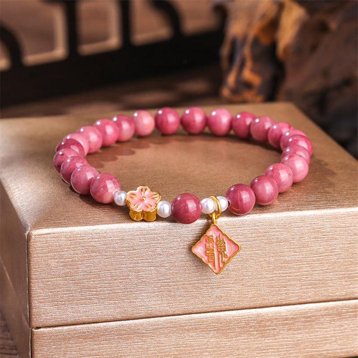 Pulsera de energía amorosa con rodonita y flor de durazno de Buddha Stones
