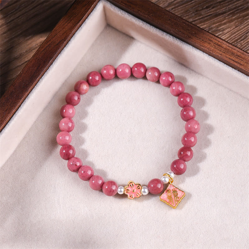 Pulsera de energía amorosa con rodonita y flor de durazno de Buddha Stones