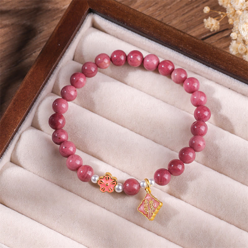 Pulsera de energía amorosa con rodonita y flor de durazno de Buddha Stones