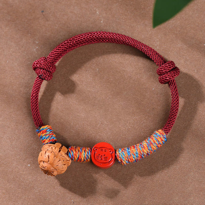 Pulsera de la suerte hecha a mano con Buddha Stones y cinabrio de hueso de melocotón con hilo rojo del zodíaco chino