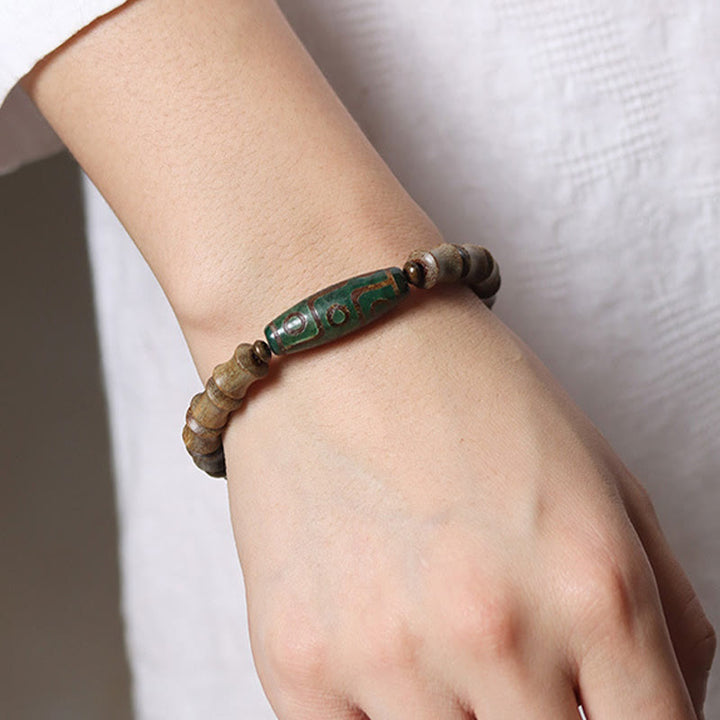 Pulsera de la paz de sándalo verde con cuentas Dzi tibetanas de nueve ojos y Buddha Stones