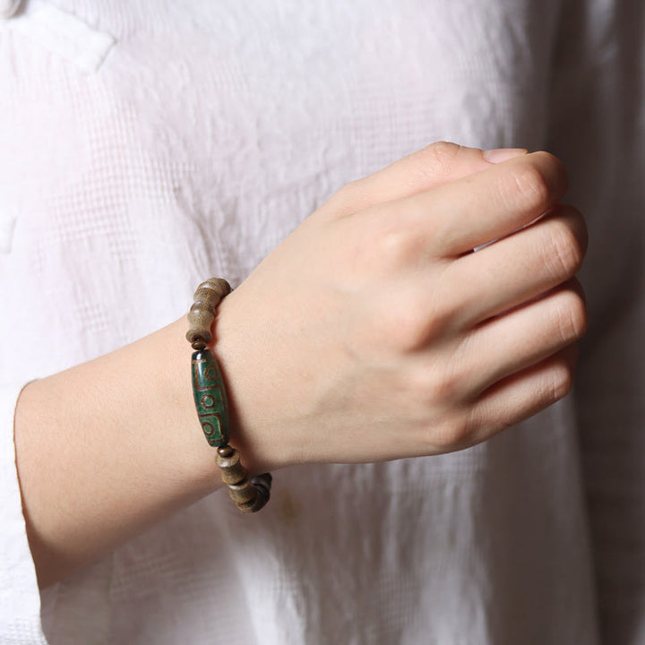 Pulsera de la paz de sándalo verde con cuentas Dzi tibetanas de nueve ojos y Buddha Stones