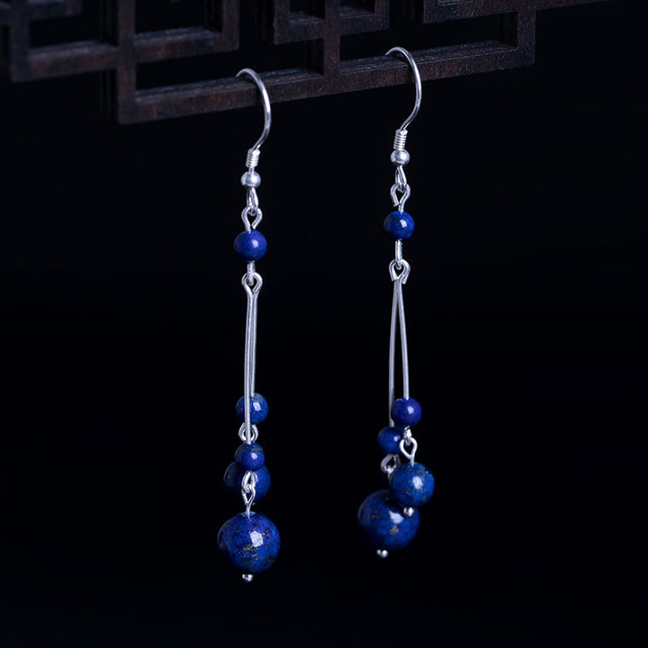 Pendientes colgantes Serenity con cuentas de lazurita y Buddha Stones en plata de ley 925