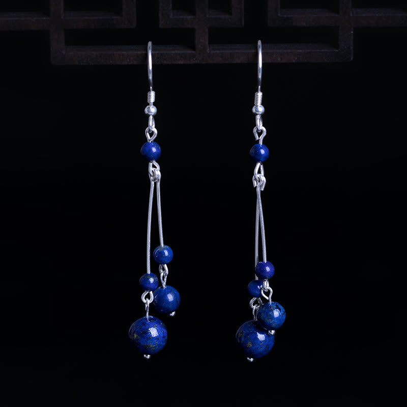 Pendientes colgantes Serenity con cuentas de lazurita y Buddha Stones en plata de ley 925