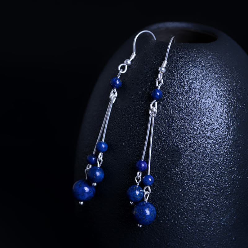 Pendientes colgantes Serenity con cuentas de lazurita y Buddha Stones en plata de ley 925