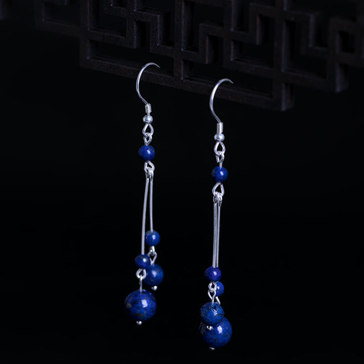 Pendientes colgantes Serenity con cuentas de lazurita y Buddha Stones en plata de ley 925