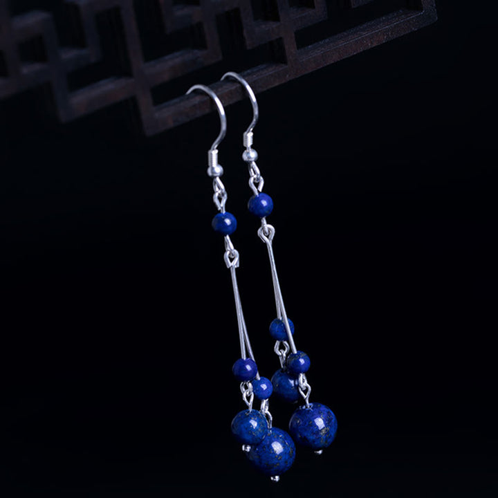 Pendientes colgantes Serenity con cuentas de lazurita y Buddha Stones en plata de ley 925
